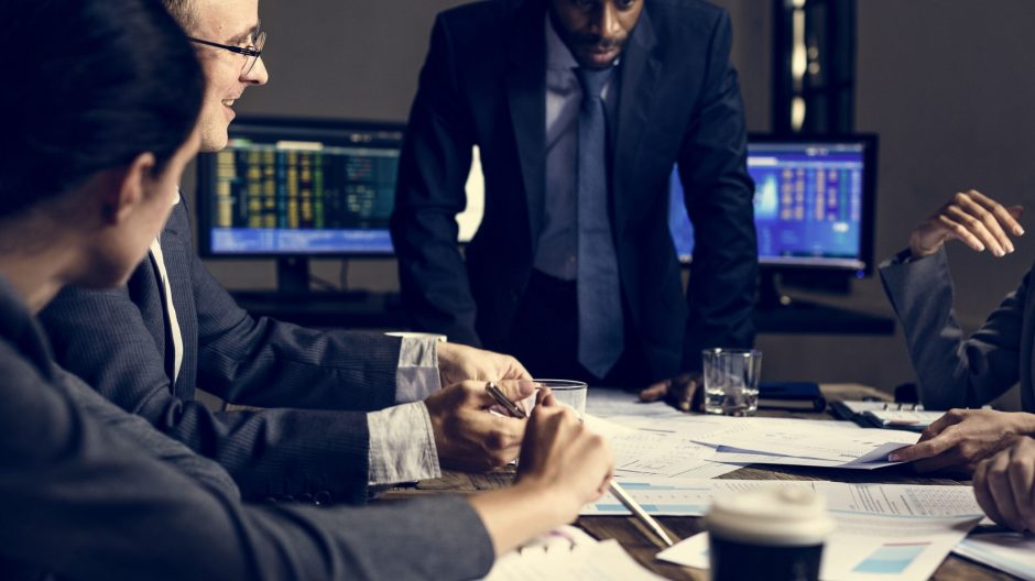 Group of entrepreneur analysing for investment in meeting room